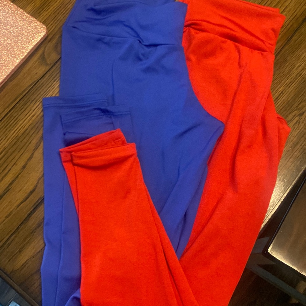 2 NWT capri style leggings. 1 red pair and 1 blue